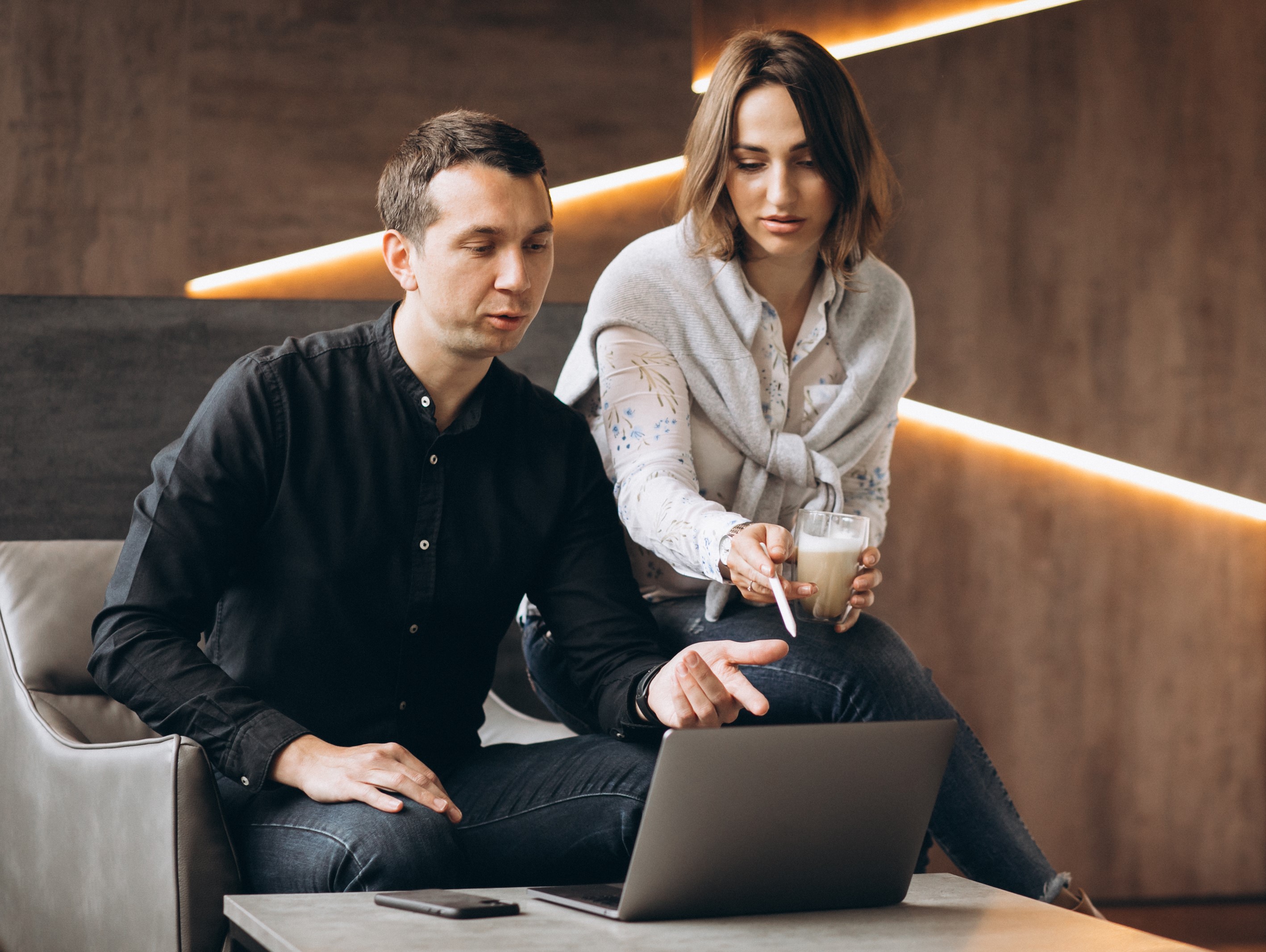Two professionals discussing on a tablet